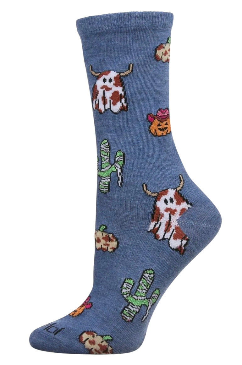 Blue sock with cow and cactus pattern on a white background